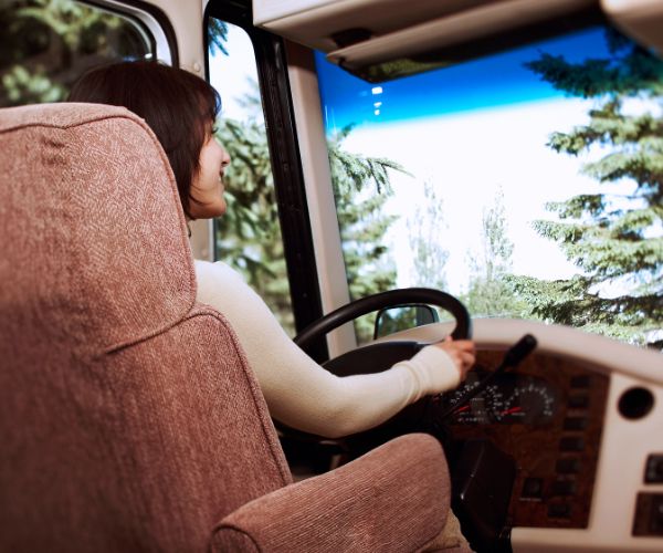 Woman driving RV by Jupiterimages